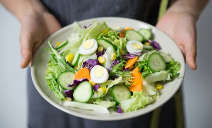 image of a plate with salad and herbs